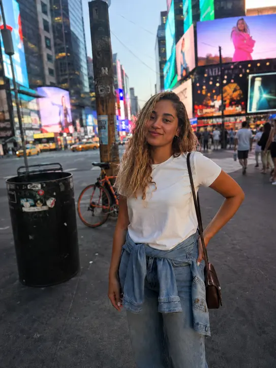 Times Square photo with trash can and passersby